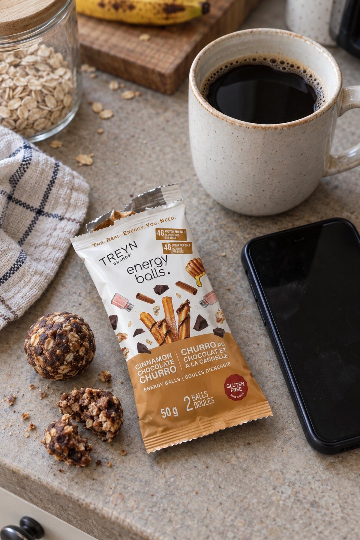 TREYN energy balls with an open pouch on a kitchen counter